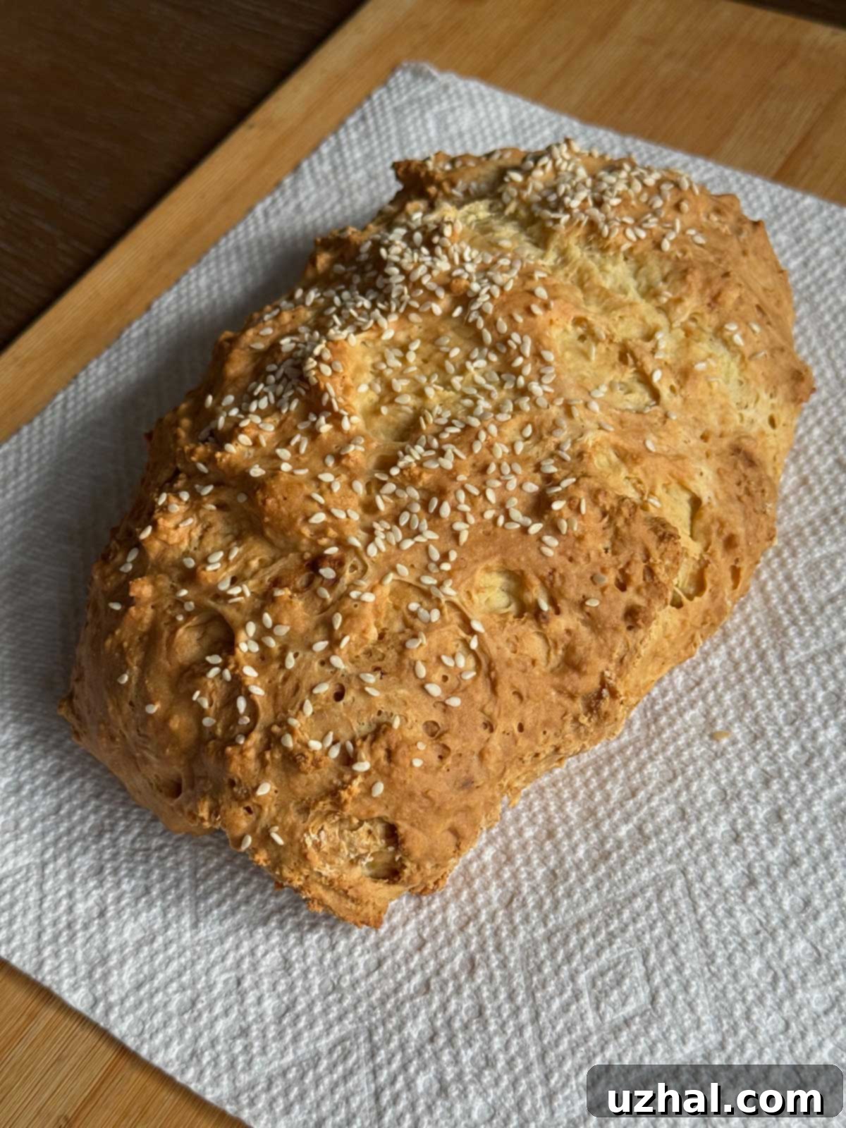 Small loaf of no-yeast sour cream and buttermilk bread with a golden crust.
