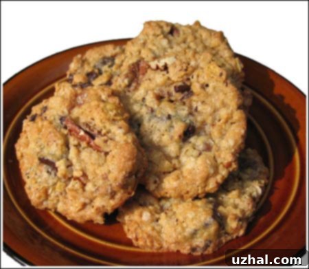 Delicious, chewy Toffee-Oat Cookies with Heath Bar pieces and cornflakes on a cooling rack