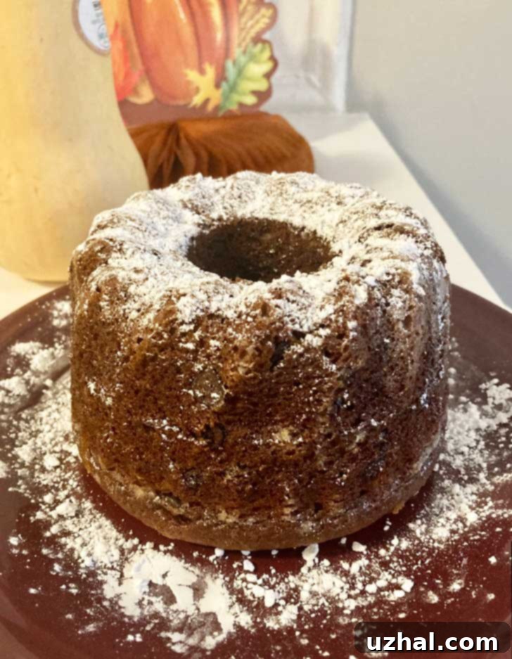 Applesauce Chocolate Chip Cake in a six inch fluted pan, showcasing its beautiful fluted design.
