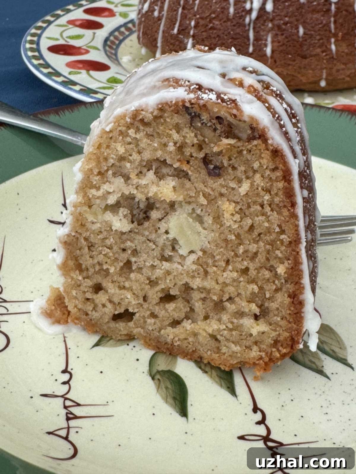 Slice of sour cream apple bundt cake recipe baked in 6-cup Bundt pan.