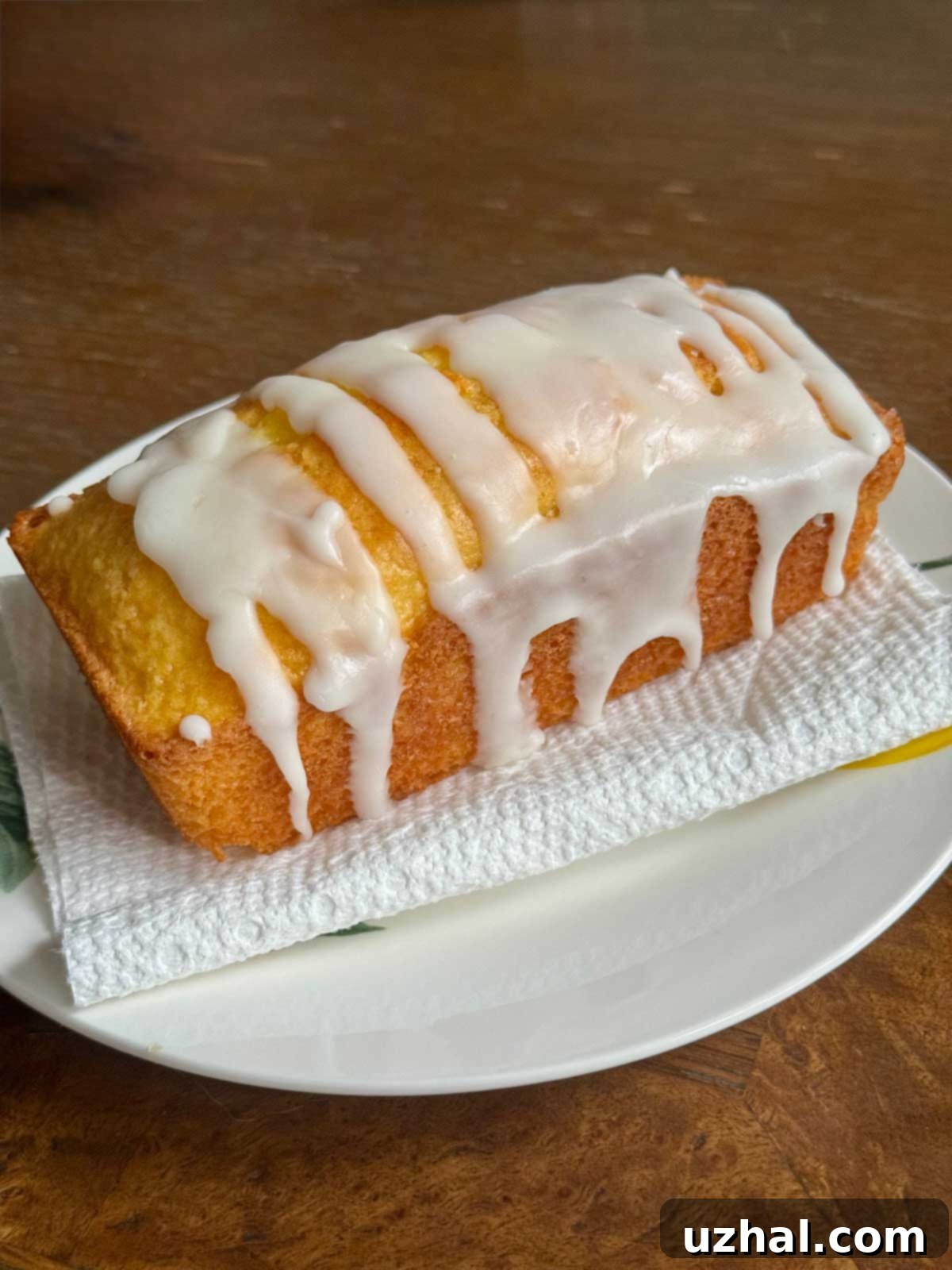 Small Starbucks Copycat Lemon Loaf Cake made with cake mix, featuring a vibrant yellow hue and a delicate glaze.