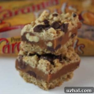Milk Chocolate Caramel Oat Bars recipe adapted to fit a 9x13 inch pan, featuring a golden crust and rich caramel.