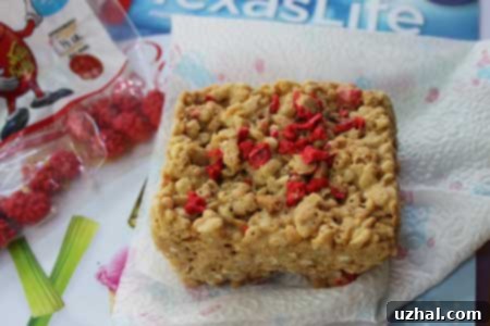 Close-up of Peanut Butter Rice Krispies Treats without marshmallows, showing their texture and readiness to be enjoyed.