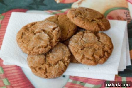 Perfectly crunchy ginger cookies on a cooling rack.
