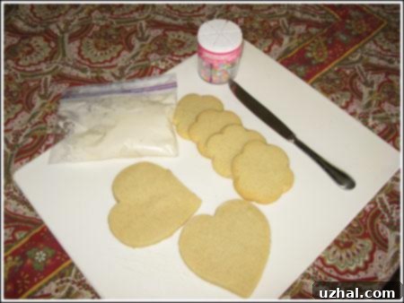 Freshly baked cut-out sugar cookies, simple and golden, ready for decorating