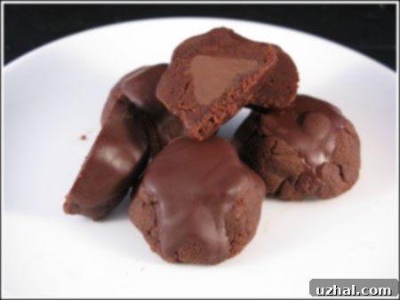 Inside Out Brownie Cookies made with a can of condensed milk, chocolate chips, butter and Hershey's Kisses.