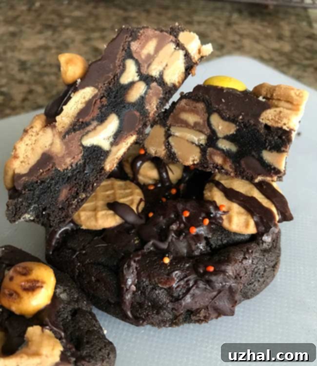 Unbaked cookie dough balls with chocolate and peanut butter chips