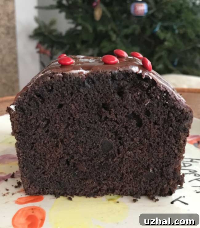 A perfectly baked loaf of buttermilk chocolate cake, ready to be sliced and enjoyed.