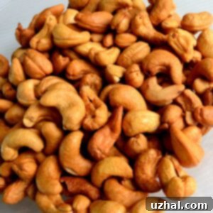 Garlic Cashews are raw cashews roasted with a coating of savory spices, creating a delicious and addictive snack.
