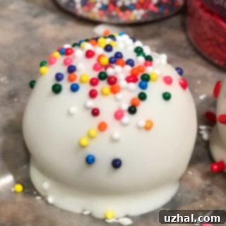 A plate full of beautifully decorated Golden Oreo Truffles
