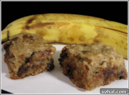 Close-up of a stack of freshly baked Banana Walnut Chocolate Chip Bars with a vegan option, showcasing their soft interior.
