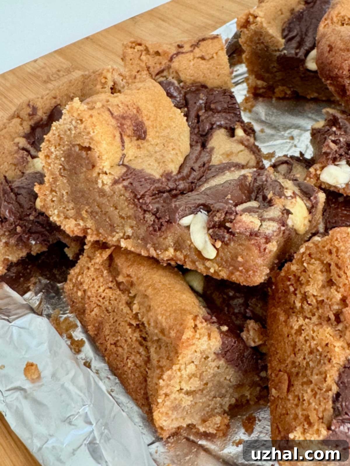 Freshly baked Marbled Nutella Peanut Butter Bars cooling on a wire rack, showcasing the rich, fudgy texture.