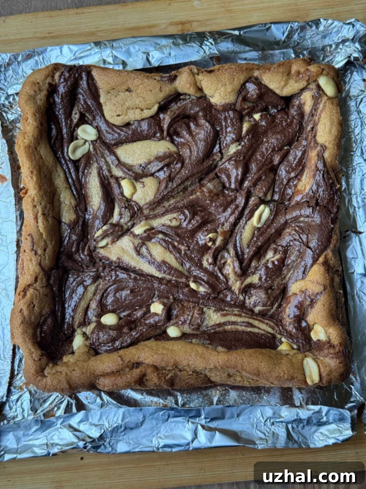 Nutella Marbled Peanut Butter Bars freshly baked with visible swirls and crispy edges.