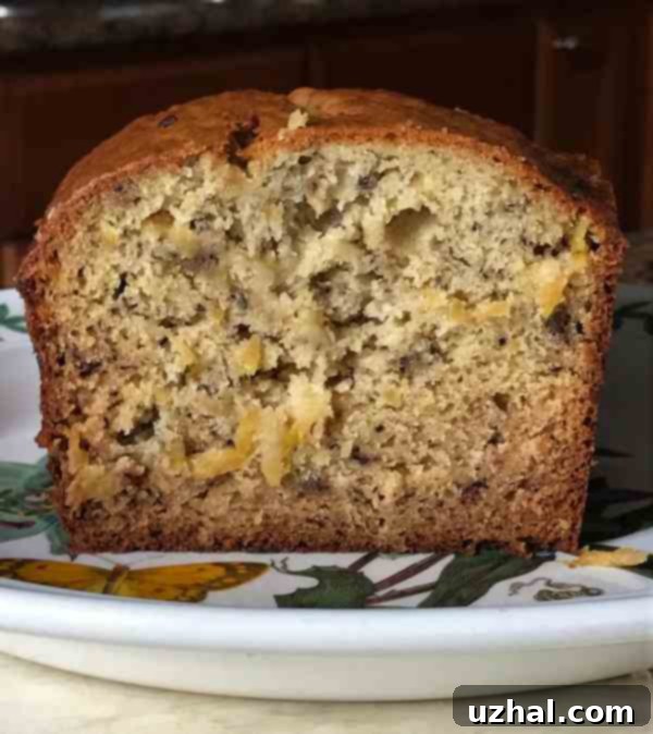 Slice of Tropical Banana Bread with a golden brown crust