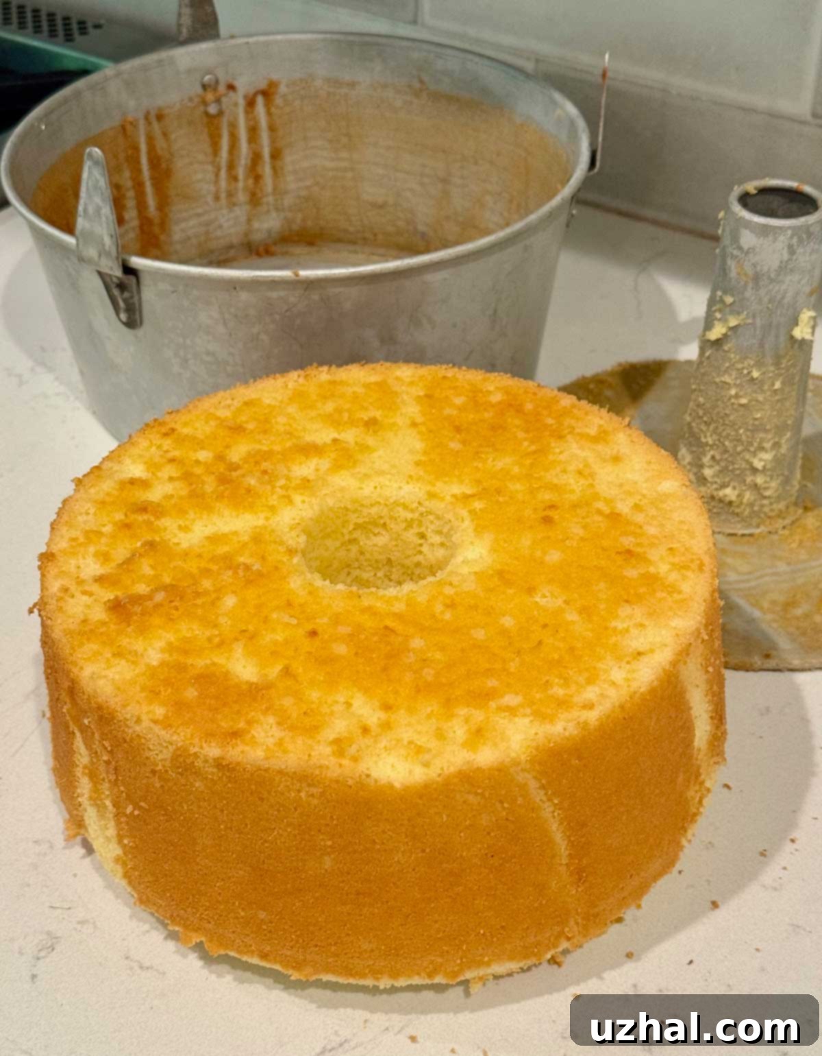 Beautifully baked Chiffon cake successfully turned out of the tube pan, ready for serving.