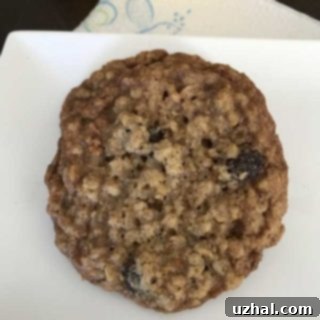 thin chewy oatmeal cookies on a cooling rack