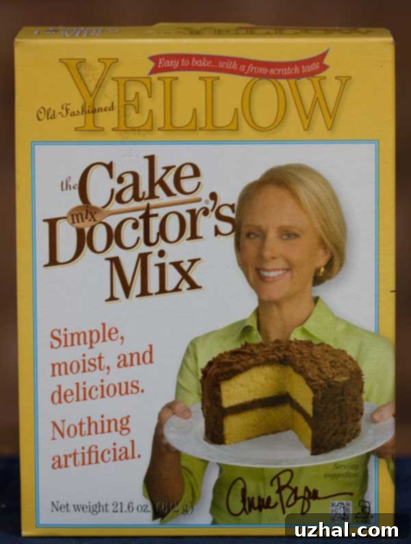 A box of Cake Mix Doctor mix next to ingredients, symbolizing the ease and inspiration for this chocolate frosting recipe.