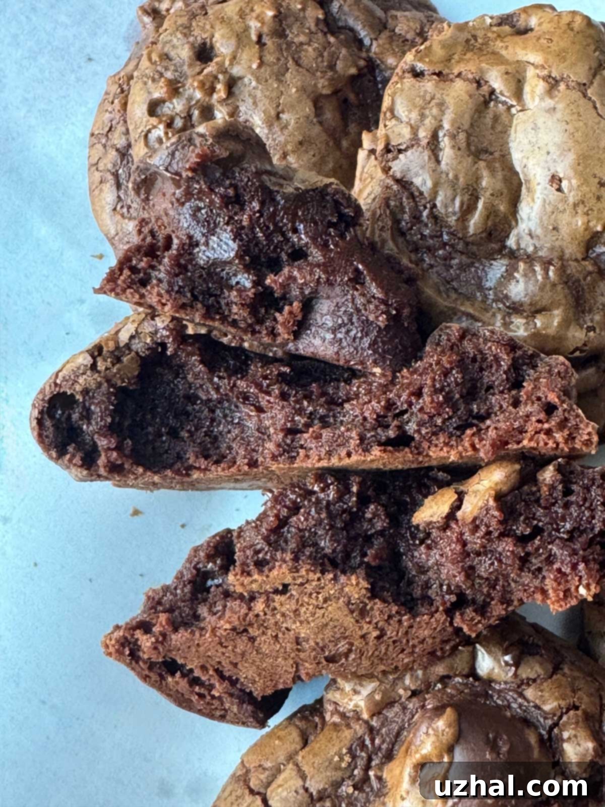 Very fudgy interior of a chocolate mocha cookie recipe, showing a dense, rich texture with melted chocolate.