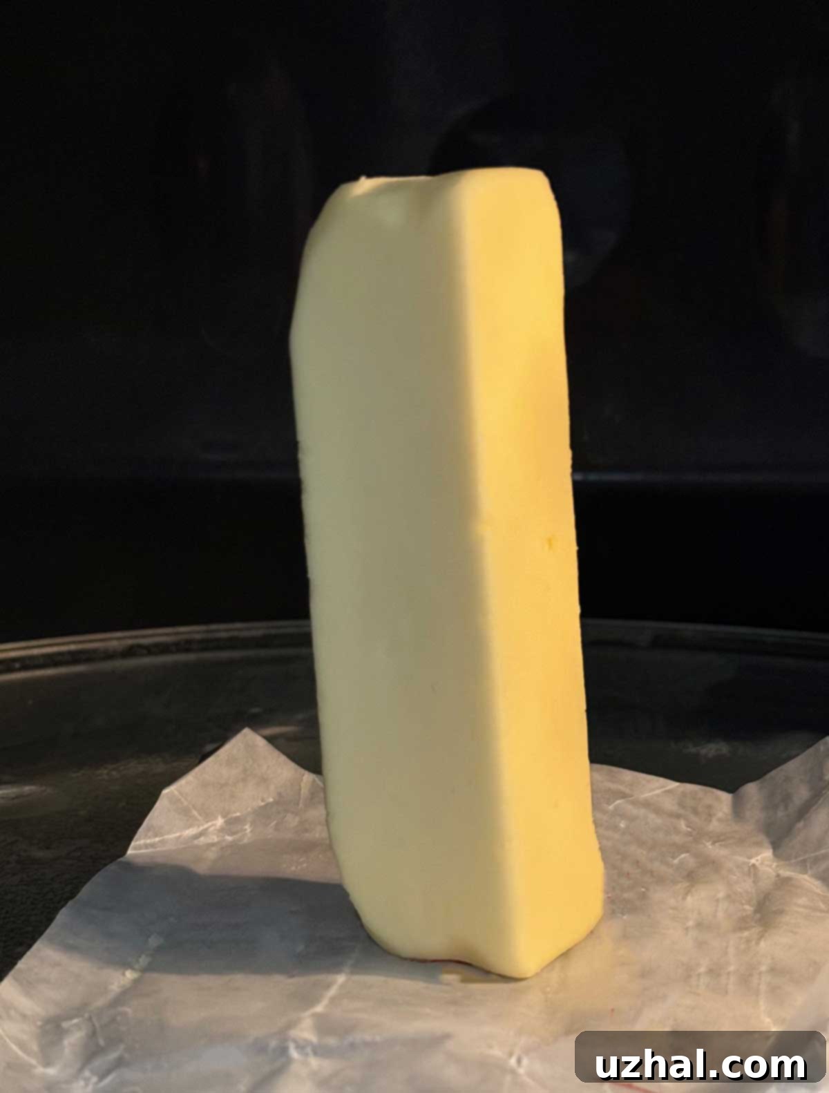 Trick for softening butter in the microwave by standing it on its end and heating for 6 seconds.