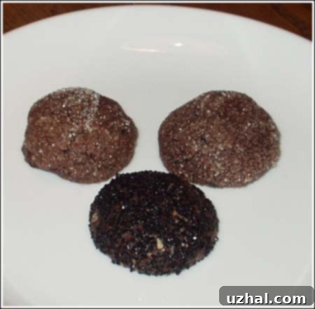 Crinkly chocolate sparkle cookies dusted with powdered sugar, a classic holiday treat.