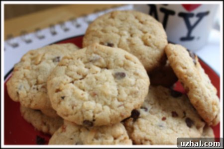 Assortment of freshly baked, golden-brown cookies on a cooling rack.