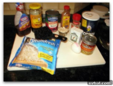 Assorted ingredients for Houston's Veggie Burger copycat, including chili powder and jalapeños, laid out on a table.
