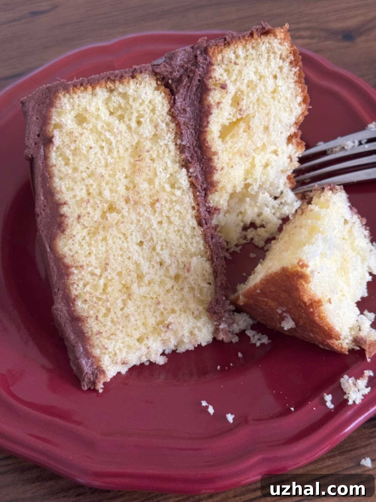 A closer view of the frosted yellow cake, showcasing its moist texture.