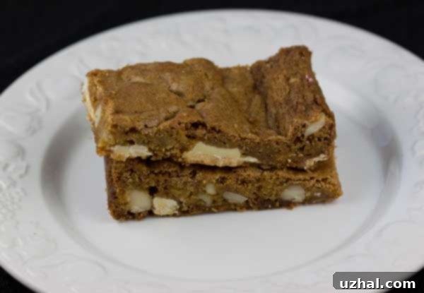 Chewy Macadamia White Chocolate Bars with a distinct golden hue and visible nuts.