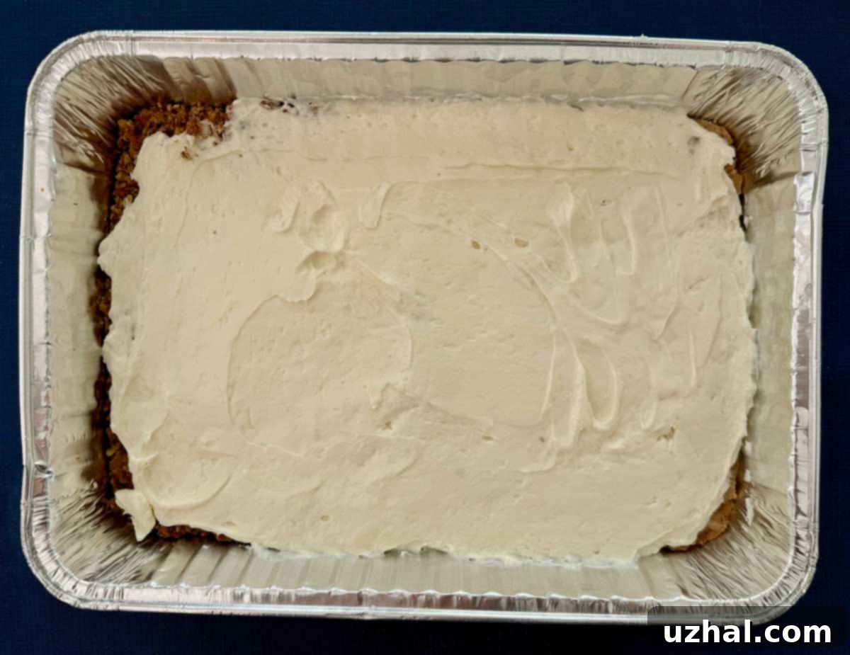 Step 2: Spreading the creamy filling over the crust