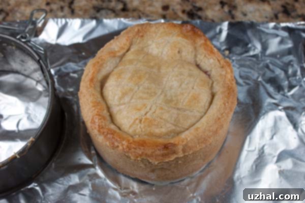 A baked mini Basque cake on a cooling rack.