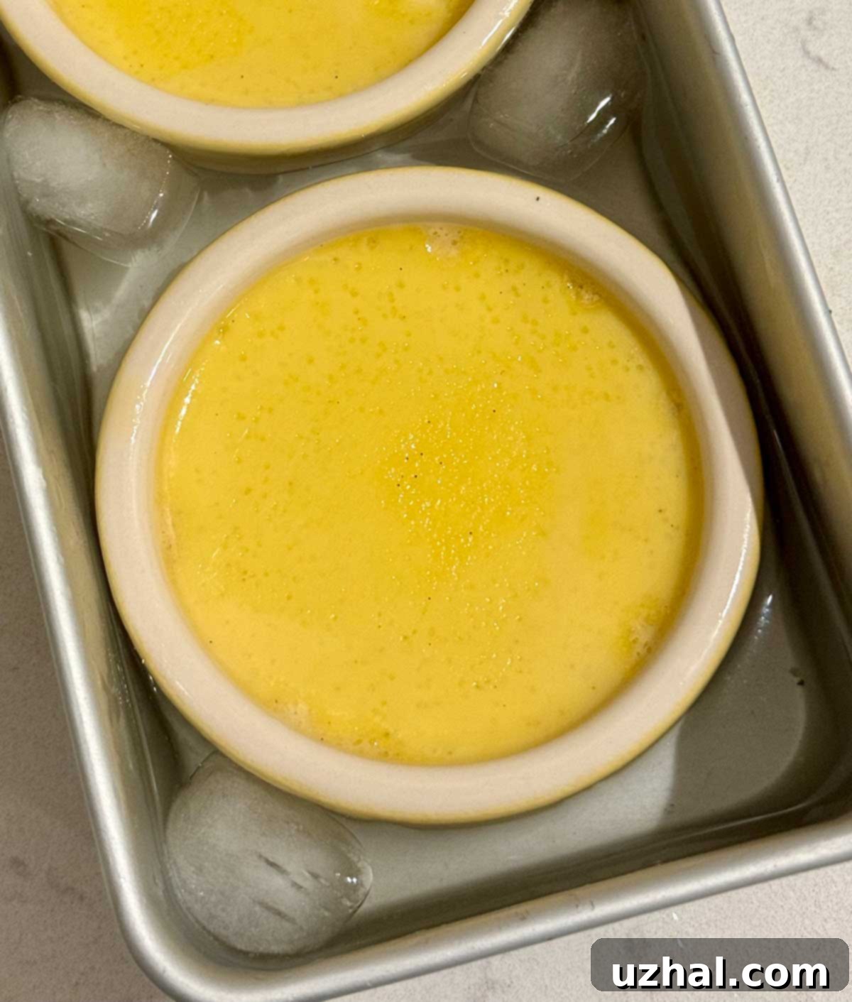 Crème Brûlée ramekins cooling in an ice bath for faster chilling