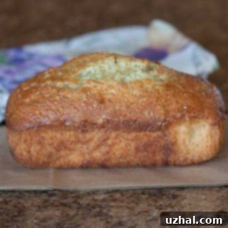 Freshly baked Orange Poppy Seed Bread with a sweet orange glaze on top.