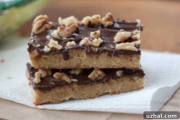 walnut toffee bars topped with chocolate and more walnuts