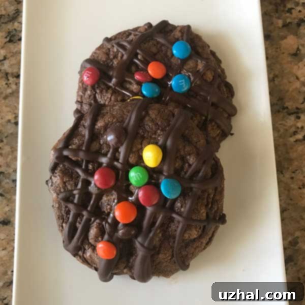 Close-up of a stack of powdered sugar chocolate cookies with a rich, soft texture