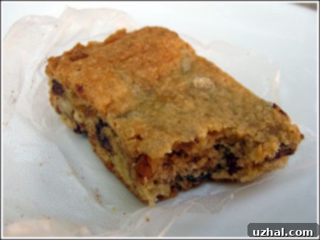 Stack of thick homemade chocolate chip bars, showcasing their dense texture