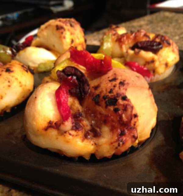 Freshly baked Focaccia Muffins with sun-dried tomato pesto and Parmesan