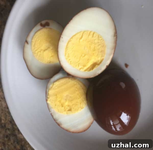 Delicious balsamic pickled eggs arranged in a glass jar, ready for pickling.