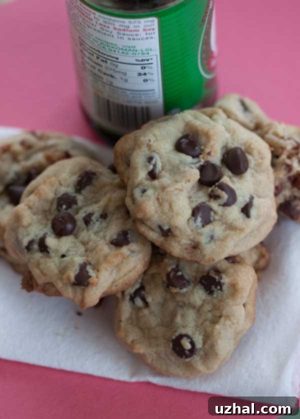 A plate of warm, freshly baked soy sauce chocolate chip cookies, showcasing their inviting texture
