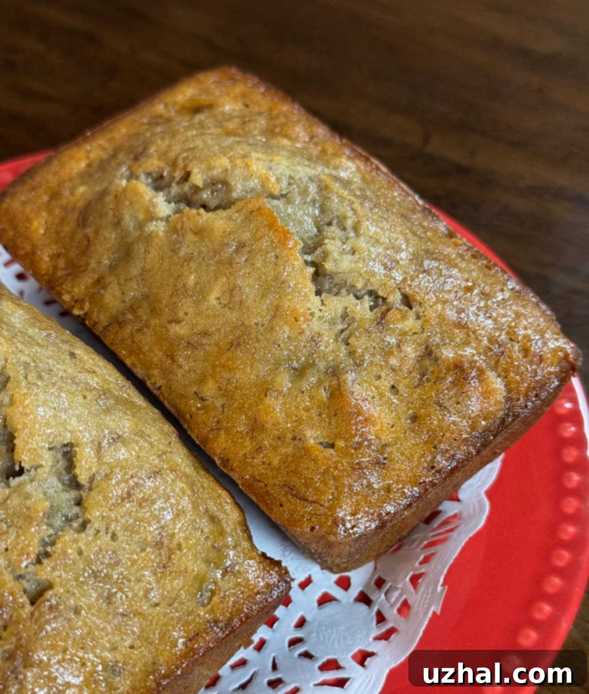 James Beard Banana Bread, beautifully baked with a golden crust, sliced to reveal its moist, dense interior.