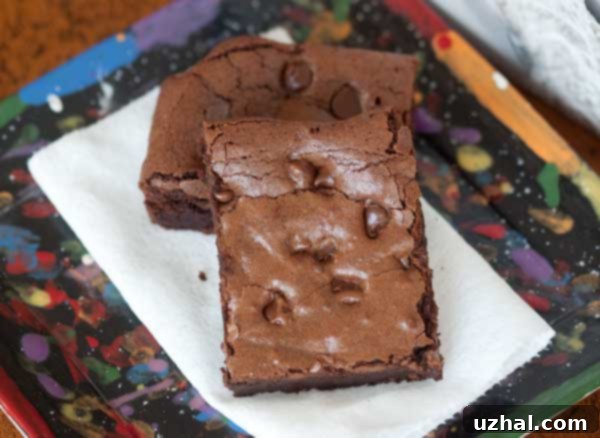Rich, fudgy gluten-free fudge brownies with a crinkly top, perfect for chocolate lovers