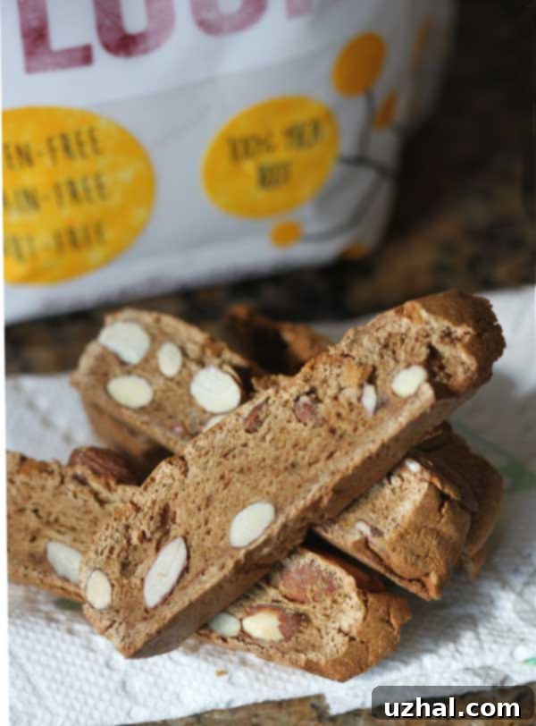 Crunchy cassava flour biscotti on a cooling rack, with a bag of Otto's Naturals Cassava Flour in the background, showcasing its gluten-free and grain-free benefits.