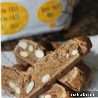 A close-up of a stack of golden-brown cassava flour biscotti, highlighting their crunchy texture.