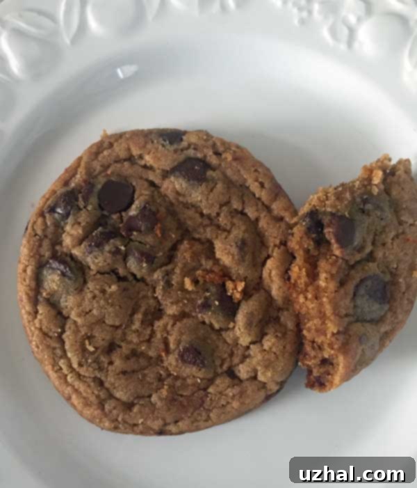 A batch of Vegan Date Paste Chocolate Chip Cookies with a slightly darker hue, showcasing a prior recipe iteration.