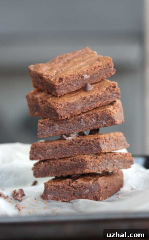 A top-down view of KitchenAid Mixer Brownies in a baking pan, showcasing their perfectly set, dense texture before cutting.