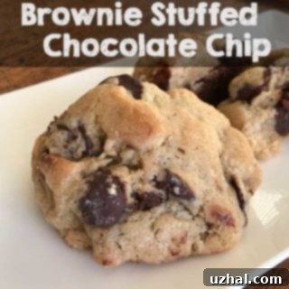 Perfectly baked Brownie Stuffed Chocolate Chip Cookies with a view of the rich brownie inside