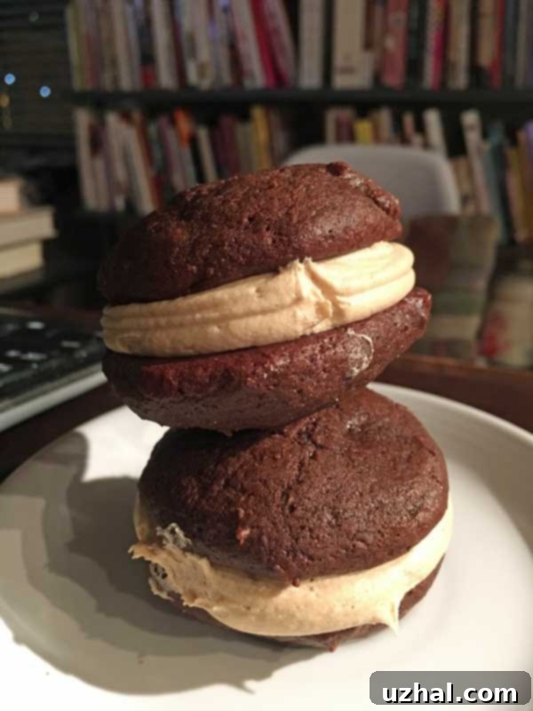 A perfectly assembled Peanut Butter Whoopie Pie, showcasing the soft chocolate cookie and rich peanut butter filling