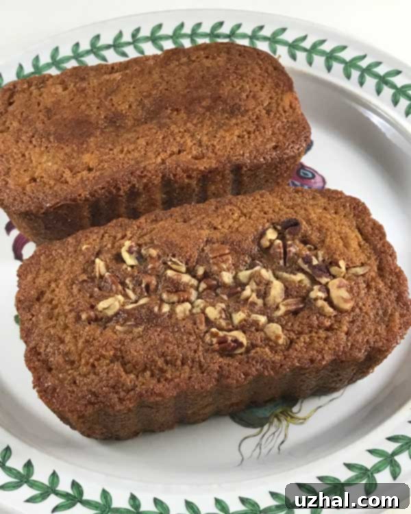 A detailed close-up of a slice of Dominique Ansel banana bread, highlighting its perfectly uniform, moist texture and appealing color.