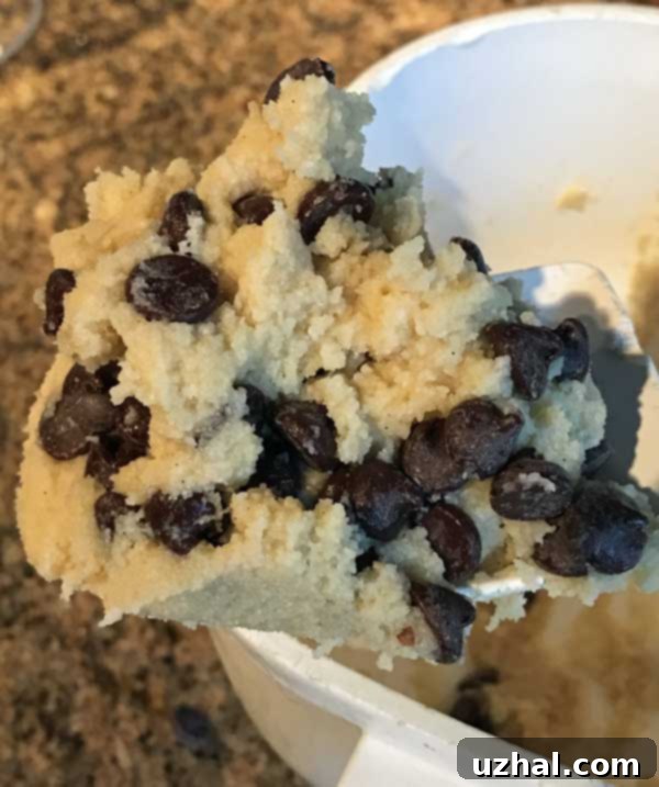 Close-up of almond flour chocolate chip cookie dough in a bowl, showing its thick consistency