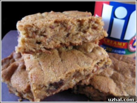 Close-up of baked Peanut Butter Blondies cut into squares, showing their soft, moist interior.
