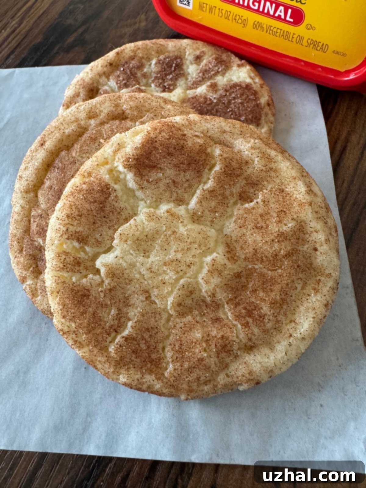 A plate of golden brown Margarine Snickerdoodles, featuring the recipe details for Olivio margarine and shortening or butter combination.